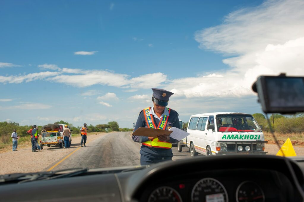 a police officer standing in the middle of the road