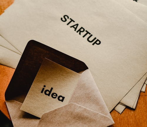 Startup folder and envelope labeled “idea,” symbolizing how to protect your business idea legally